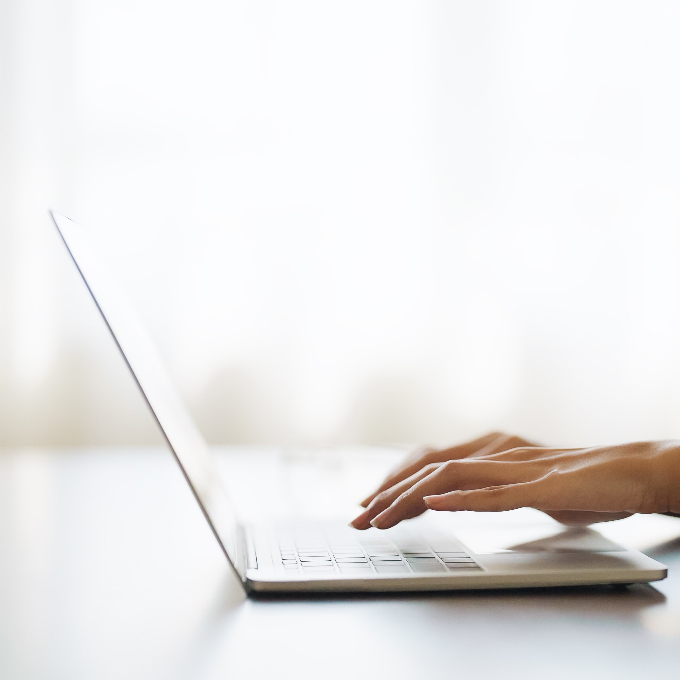 A woman searching on her laptop for "Free Parenting Classes in Shelton, Washington"