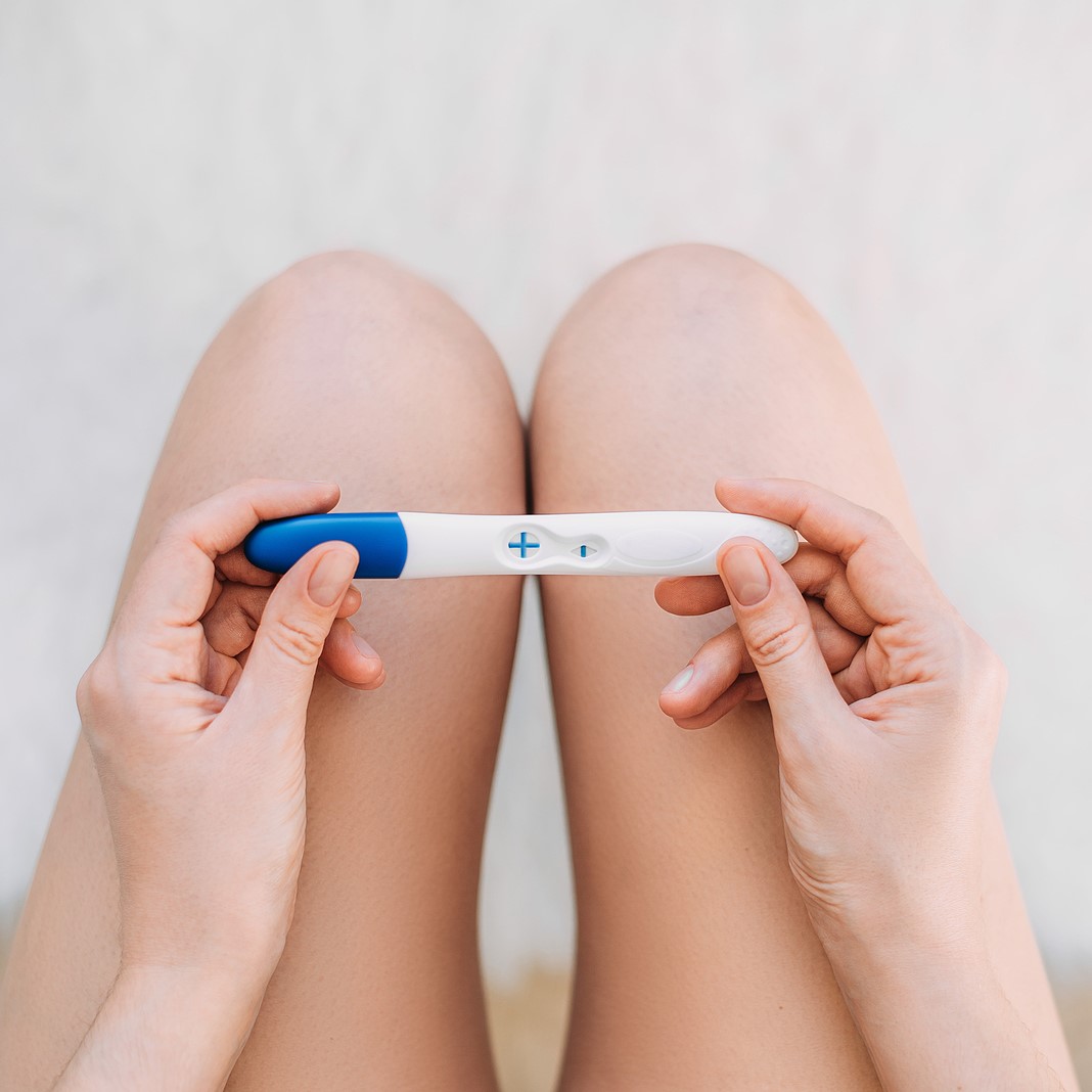 Free Pregnancy Tests A woman holding a free pregnancy test in Shelton, Washington