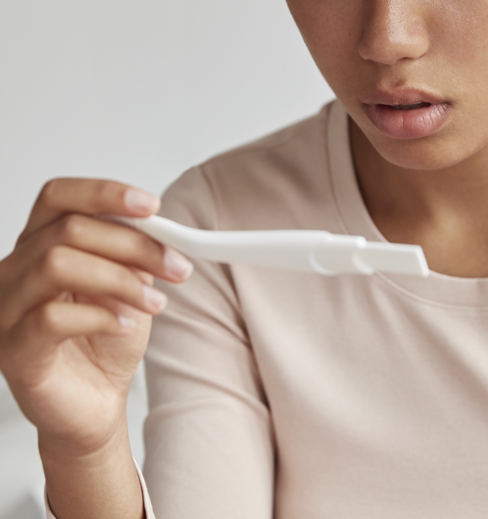 A woman holding a free pregnancy test at Care Net Pregnancy Center of Mason County